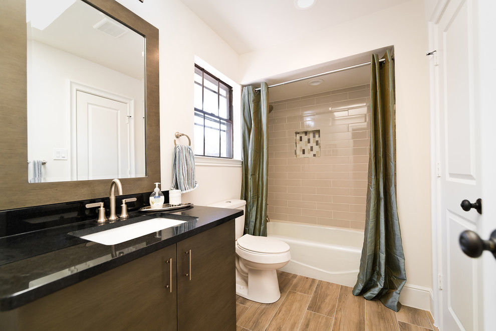 Example of a mid-sized transitional kids' gray tile and porcelain tile porcelain tile and gray floor freestanding bathtub design in Dallas with furniture-like cabinets, distressed cabinets, a two-piece toilet, white walls, an undermount sink, granite countertops, a hinged shower door and black countertops