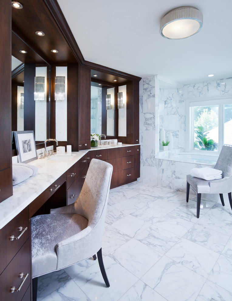 Photo of a medium sized mediterranean ensuite bathroom in New York with white tiles, marble tiles, marble flooring, a submerged sink, marble worktops, white floors, white worktops, dark wood cabinets, a submerged bath and flat-panel cabinets.