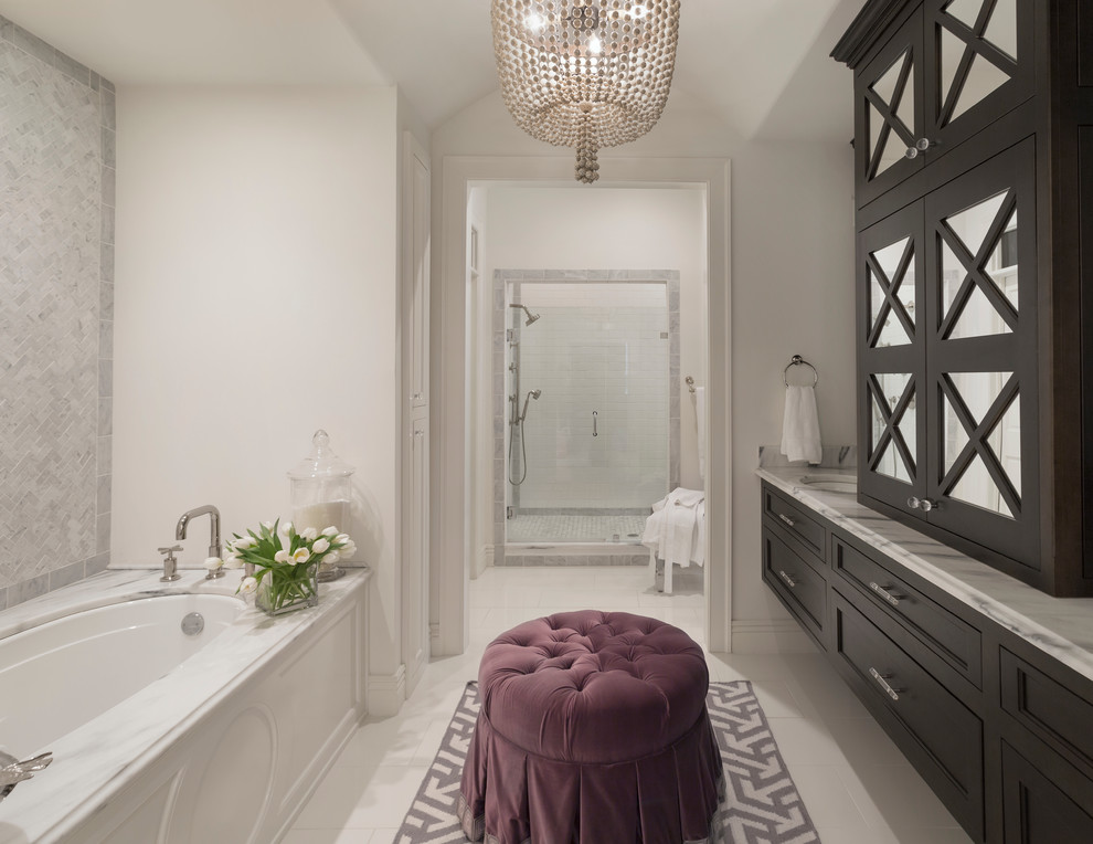 Design ideas for a large classic ensuite bathroom in Little Rock with a submerged sink, recessed-panel cabinets, marble worktops, a submerged bath, an alcove shower, white tiles, stone tiles, white walls, ceramic flooring and black cabinets.