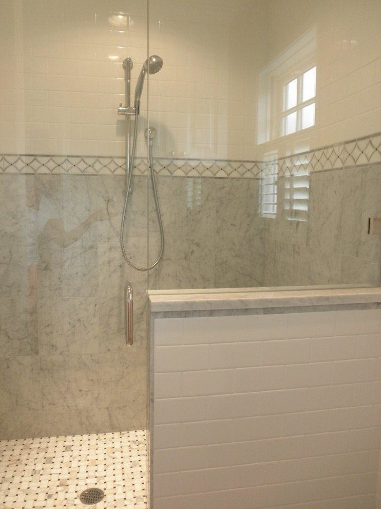 Mid-sized elegant master white tile and subway tile marble floor bathroom photo in Portland with white cabinets, raised-panel cabinets, a one-piece toilet, white walls, an undermount sink and marble countertops