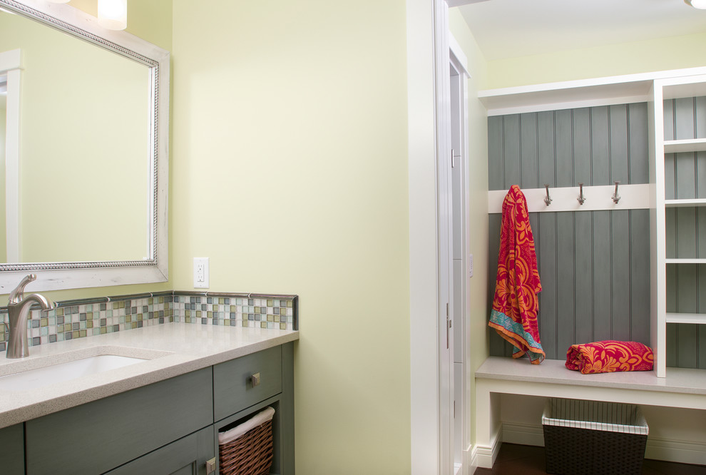 Example of a mid-sized beach style multicolored tile and mosaic tile light wood floor bathroom design in Grand Rapids with recessed-panel cabinets, gray cabinets, quartzite countertops, yellow walls and an undermount sink