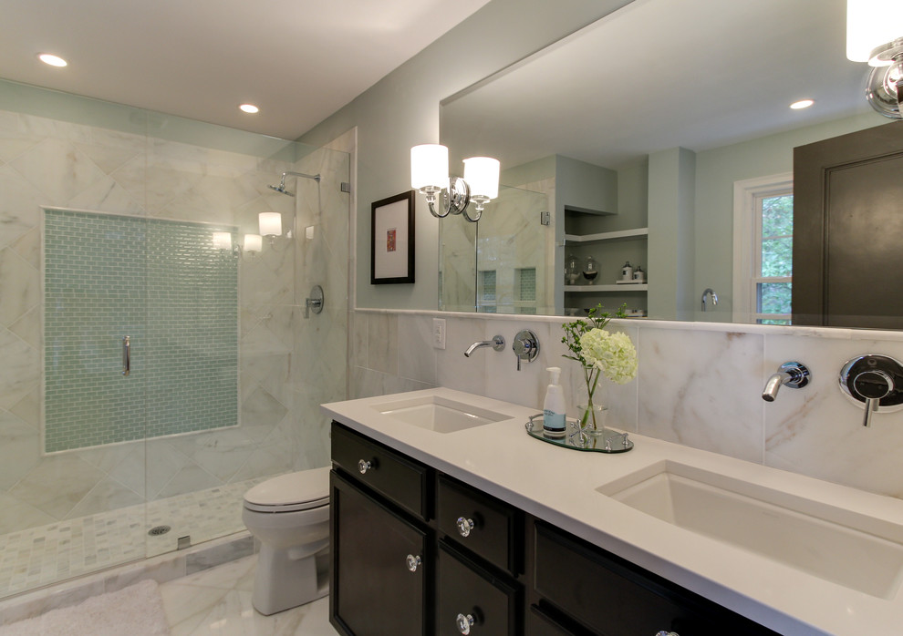Mid-sized elegant master white tile and stone tile marble floor bathroom photo in Raleigh with an undermount sink, recessed-panel cabinets, dark wood cabinets, quartzite countertops, a one-piece toilet and blue walls