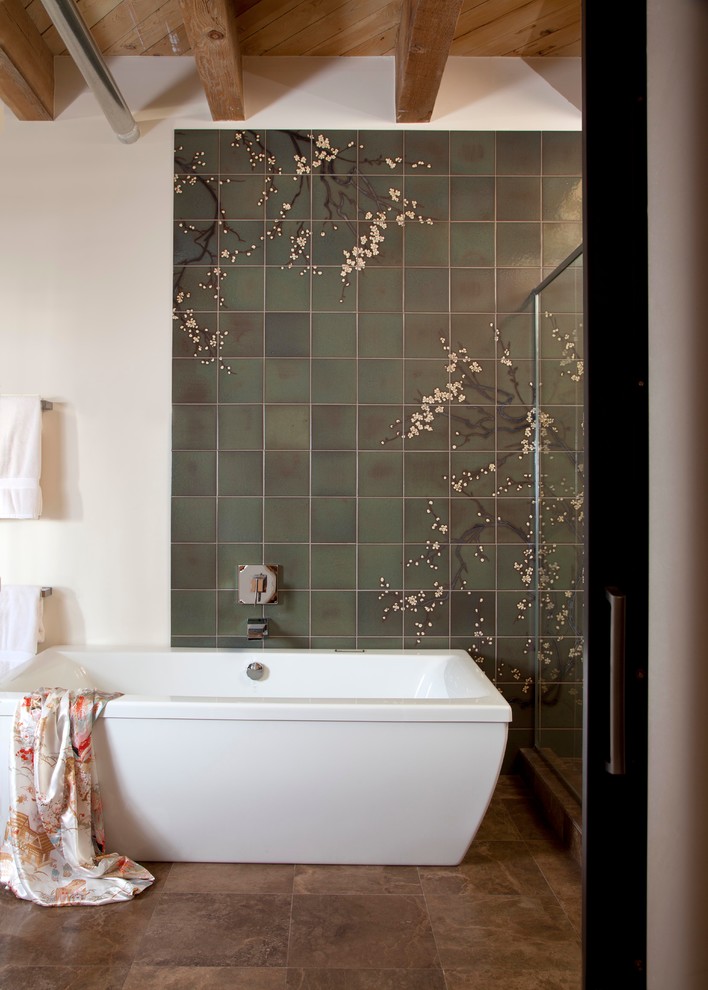 Example of a large trendy master green tile and ceramic tile travertine floor bathroom design in Denver with an undermount sink, flat-panel cabinets, medium tone wood cabinets, marble countertops, a wall-mount toilet and white walls