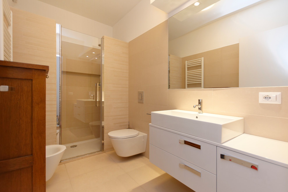 Mid-sized trendy master beige tile and ceramic tile ceramic tile double shower photo in Milan with a console sink, wood countertops, a wall-mount toilet and white walls