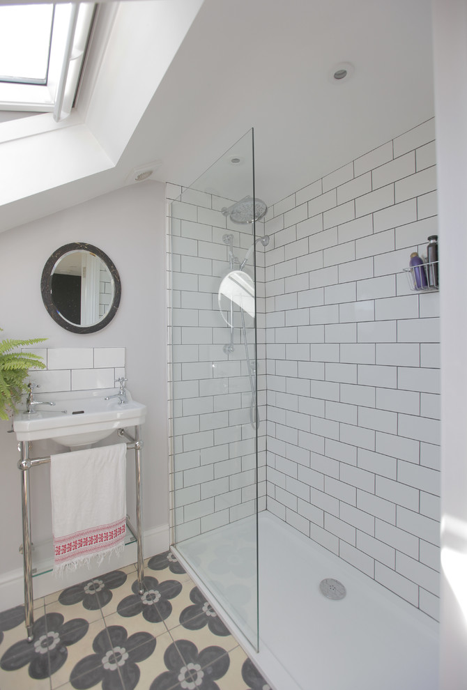 Photo of a small contemporary bathroom in London with a walk-in shower, white tiles, metro tiles, grey walls, ceramic flooring, a console sink and beige floors.