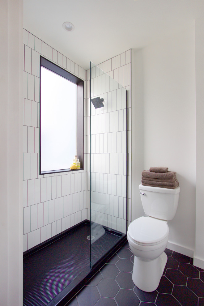 Design ideas for a small modern shower room bathroom in Other with an alcove shower, a two-piece toilet, white tiles, ceramic tiles, white walls, ceramic flooring, black floors and an open shower.