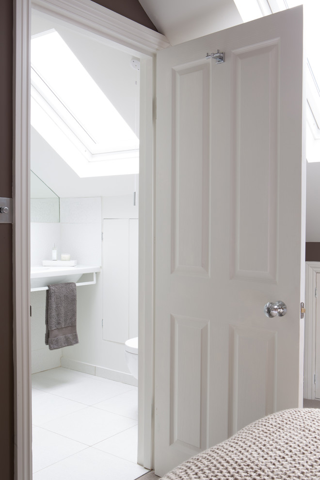 This is an example of a contemporary bathroom in Kent with brown walls.
