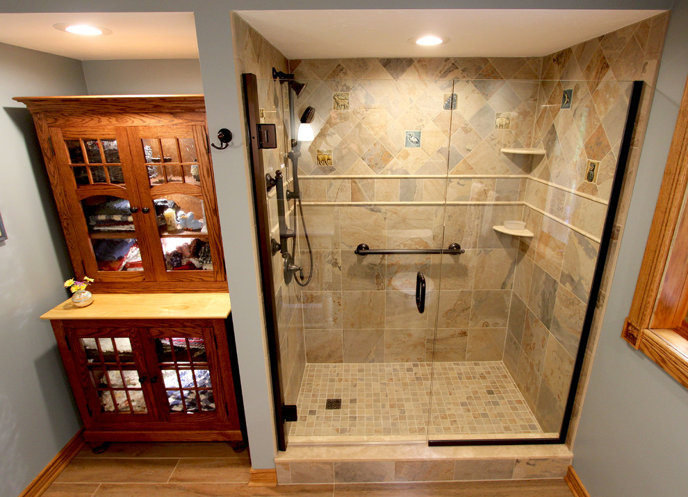 Medium sized rustic ensuite bathroom in Cleveland with a corner shower, beige tiles, porcelain tiles, blue walls, porcelain flooring, a submerged sink and beige floors.
