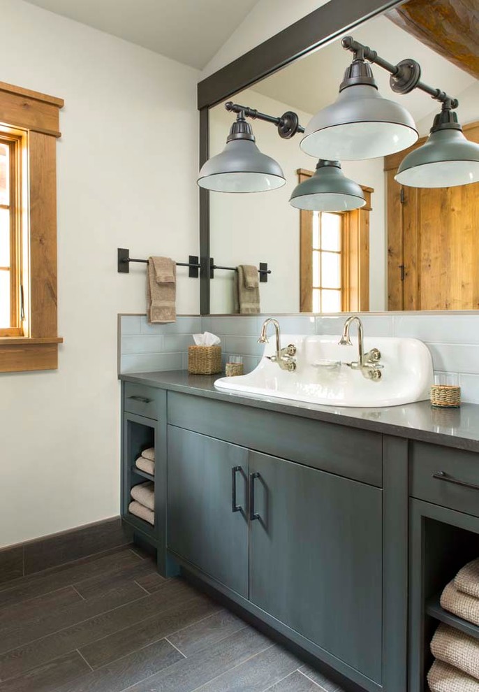 Example of a mountain style bathroom design in Denver with a trough sink, flat-panel cabinets, gray cabinets and white walls