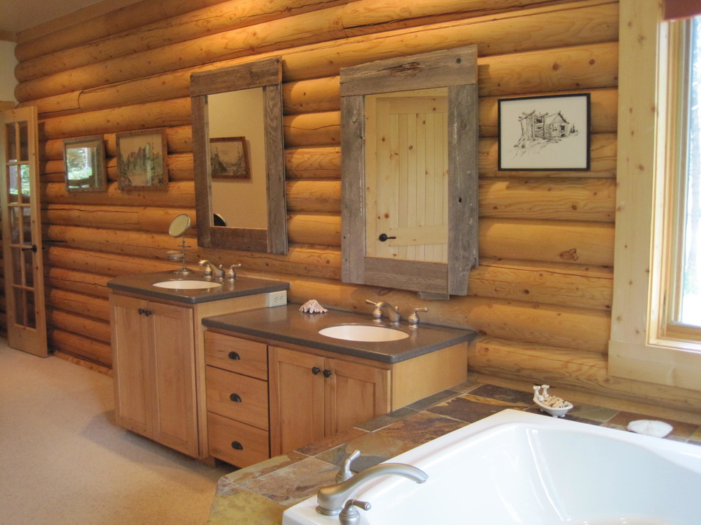Inspiration for a large rustic ensuite bathroom in Denver with recessed-panel cabinets, light wood cabinets, solid surface worktops, an alcove shower, multi-coloured tiles, stone slabs, an integrated sink, a corner bath, a two-piece toilet and brown walls.
