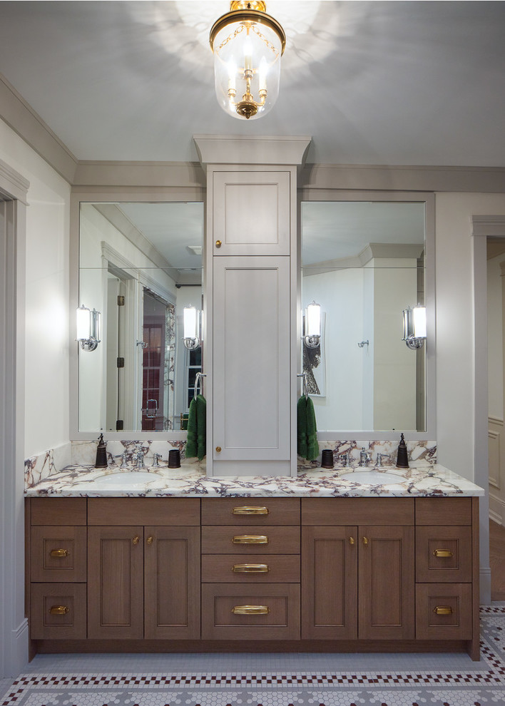 Photo of a large traditional ensuite bathroom in Chicago with freestanding cabinets, brown cabinets, a freestanding bath, a walk-in shower, a one-piece toilet, red tiles, ceramic tiles, white walls, ceramic flooring, a submerged sink, marble worktops, multi-coloured floors, a hinged door and multi-coloured worktops.