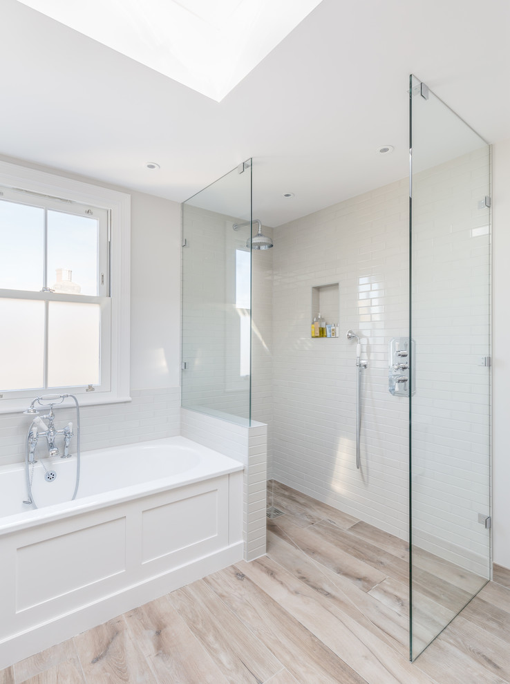 Example of a large classic white tile and subway tile beige floor bathroom design in London with recessed-panel cabinets, beige cabinets and white walls