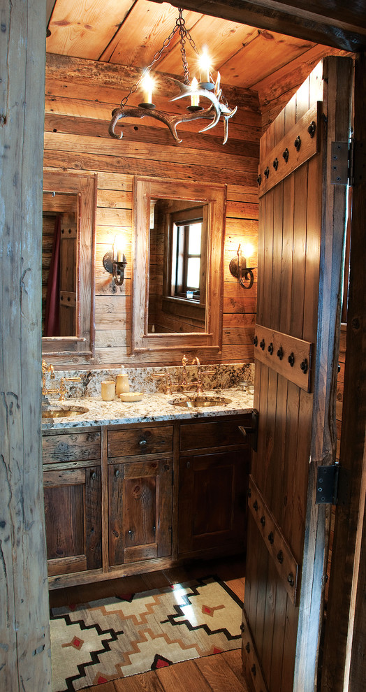 Inspiration for a rustic bathroom in Other with a submerged sink, shaker cabinets and dark wood cabinets.
