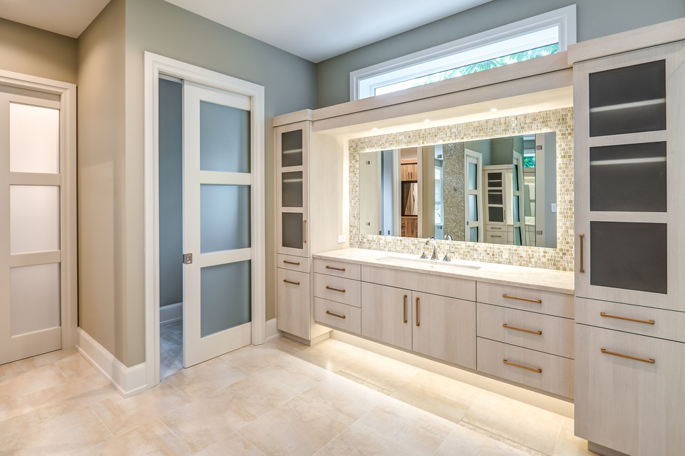 Photo of an expansive traditional ensuite wet room bathroom in Other with flat-panel cabinets, light wood cabinets, a freestanding bath, beige tiles, brown tiles, grey tiles, mosaic tiles, grey walls, porcelain flooring, a submerged sink, beige floors, an open shower and beige worktops.