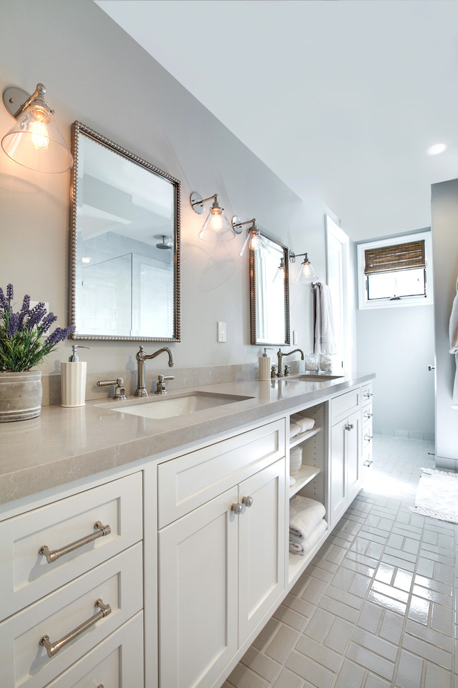 Inspiration for a medium sized nautical ensuite bathroom in Los Angeles with shaker cabinets, white cabinets, a two-piece toilet, grey walls, ceramic flooring, a submerged sink, quartz worktops, grey floors and grey worktops.