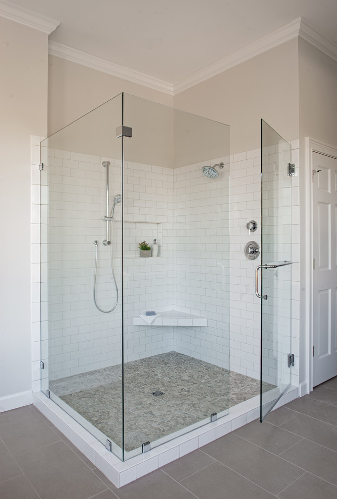 Bathroom - large transitional master white tile and pebble tile porcelain tile bathroom idea in Atlanta with shaker cabinets, medium tone wood cabinets, a two-piece toilet, white walls, an undermount sink and quartz countertops
