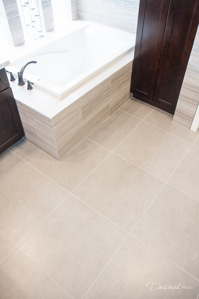 Bathroom - large transitional master gray tile and porcelain tile porcelain tile bathroom idea in Houston with an undermount sink, shaker cabinets, dark wood cabinets, quartzite countertops, a two-piece toilet and gray walls