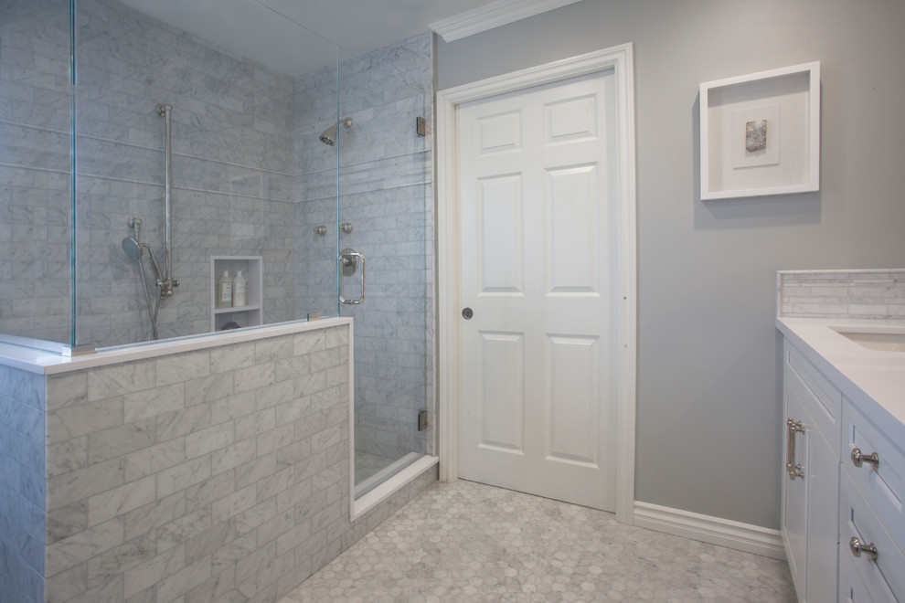 Inspiration for a medium sized contemporary ensuite bathroom in Los Angeles with shaker cabinets, white cabinets, an alcove bath, a shower/bath combination, a two-piece toilet, white tiles, metro tiles, grey walls, light hardwood flooring, a submerged sink, quartz worktops, grey floors, an open shower and white worktops.