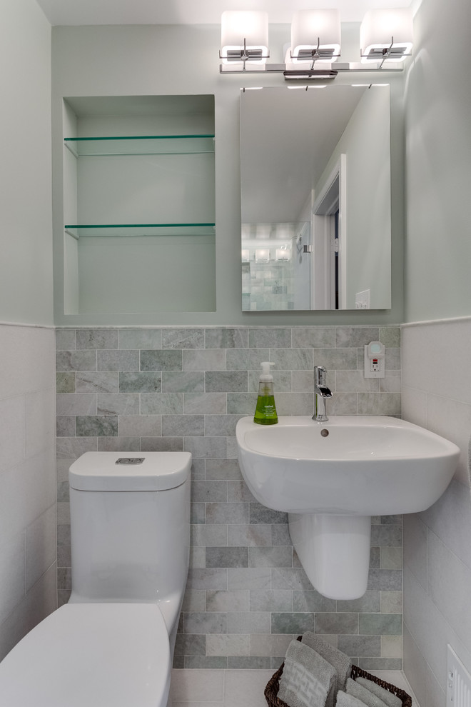 Small classic shower room bathroom in DC Metro with an alcove shower, a one-piece toilet, multi-coloured tiles, marble tiles, green walls, marble flooring, a wall-mounted sink, white floors and a sliding door.