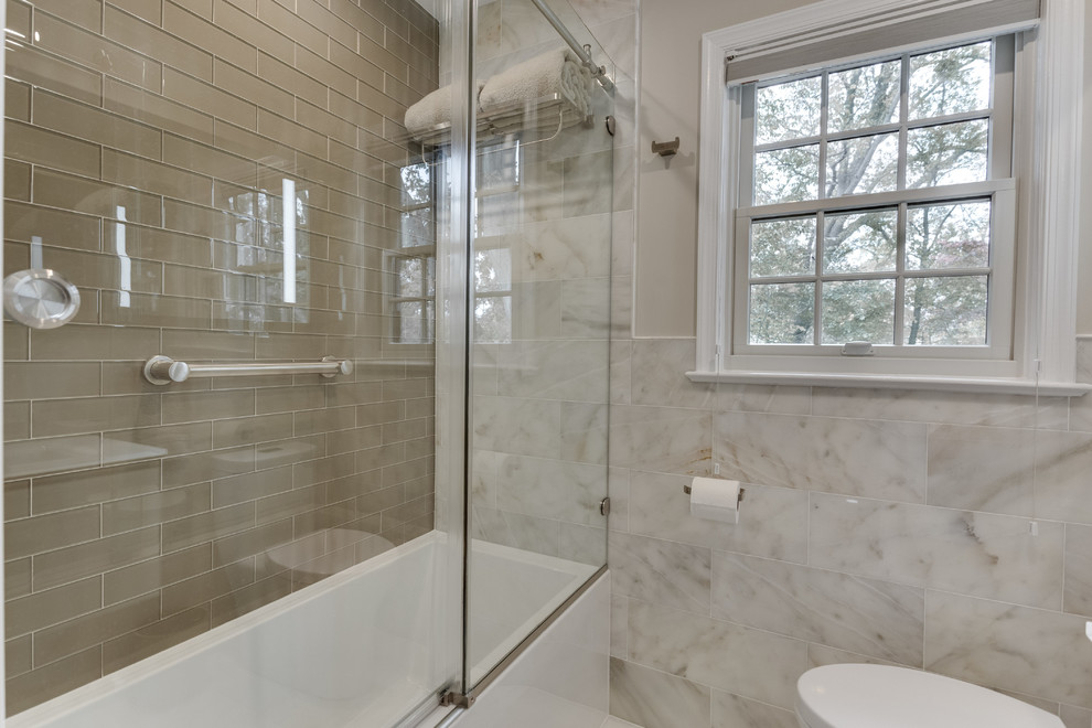 Mid-sized transitional kids' multicolored tile marble floor and multicolored floor bathroom photo in DC Metro with flat-panel cabinets, white cabinets, a one-piece toilet, beige walls, a wall-mount sink and glass countertops