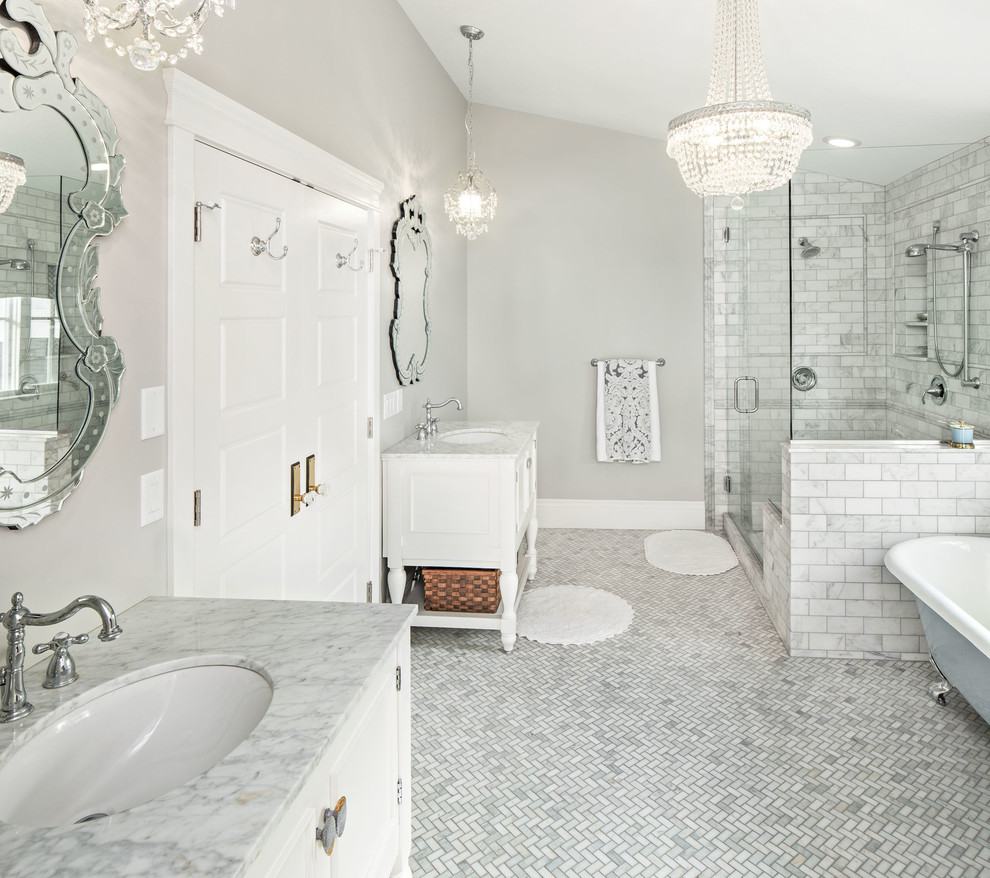 Photo of a classic bathroom in Salt Lake City with a submerged sink, white cabinets, marble worktops, a claw-foot bath, an alcove shower, white tiles, stone tiles and recessed-panel cabinets.