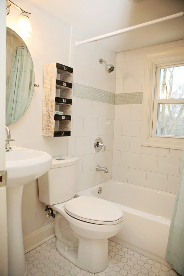 Inspiration for a small traditional bathroom in Charlotte with a pedestal sink, a shower/bath combination, white tiles, metro tiles and white walls.