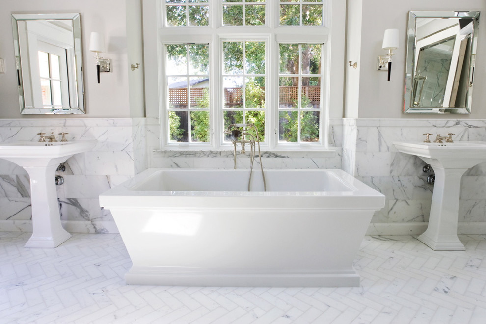 Photo of a classic bathroom in San Francisco with a freestanding bath, a pedestal sink and metro tiles.