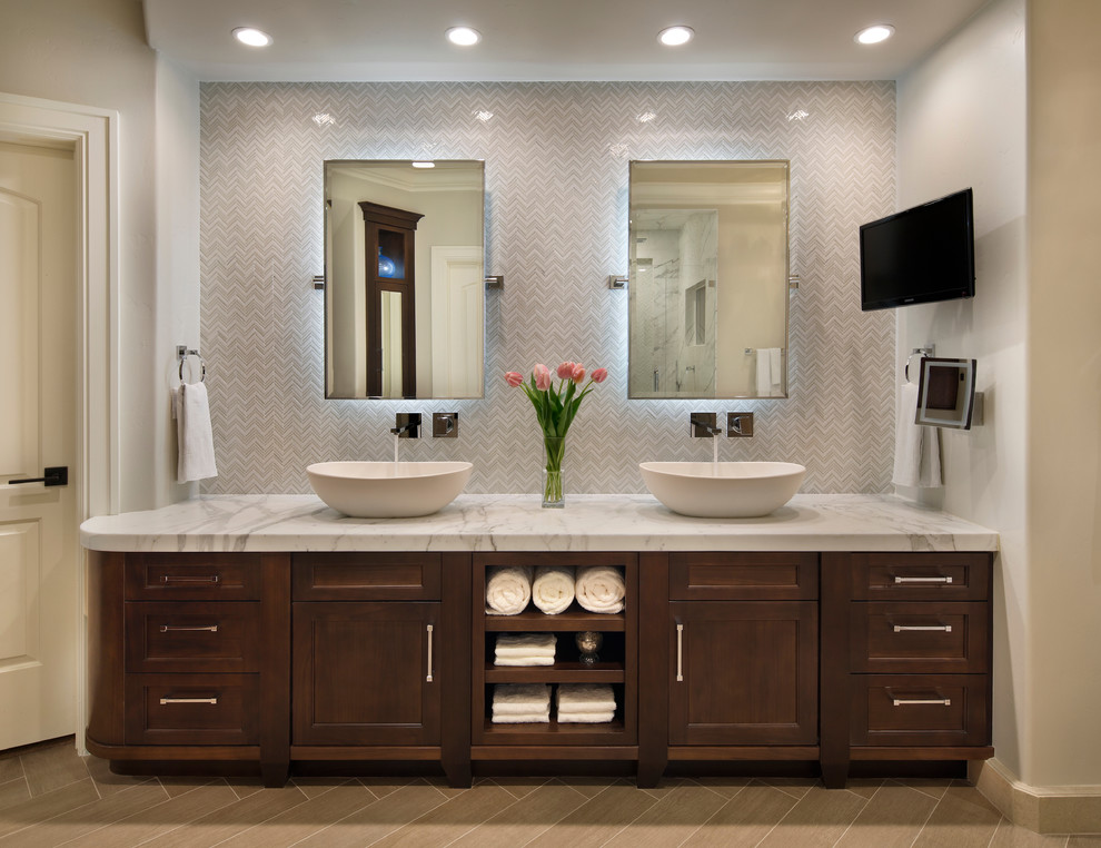 Example of a transitional white tile bathroom design in San Francisco with a vessel sink, recessed-panel cabinets and dark wood cabinets