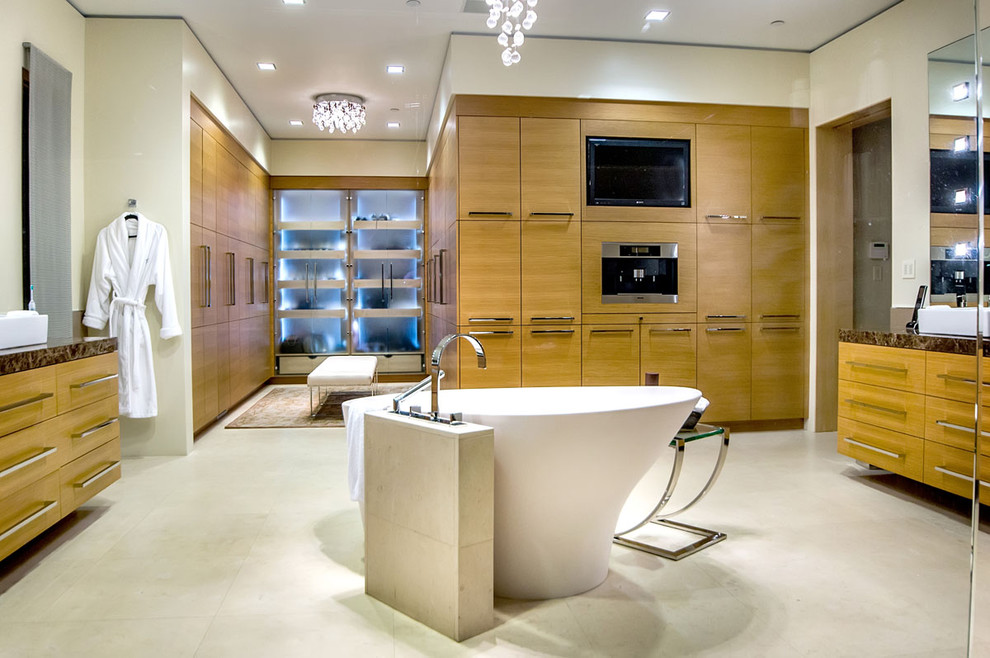 Example of a trendy freestanding bathtub design in San Francisco with granite countertops, a vessel sink, flat-panel cabinets and light wood cabinets