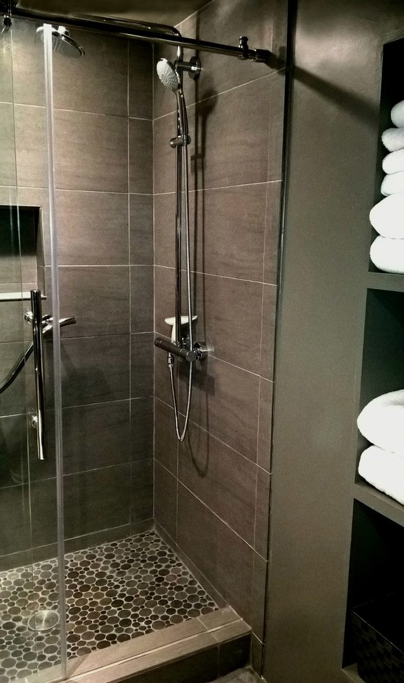 Alcove shower - small modern 3/4 porcelain tile and beige floor alcove shower idea in Los Angeles with open cabinets, a one-piece toilet, a vessel sink, glass countertops and a hinged shower door