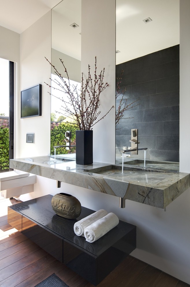 Trendy bathroom photo in Los Angeles with marble countertops