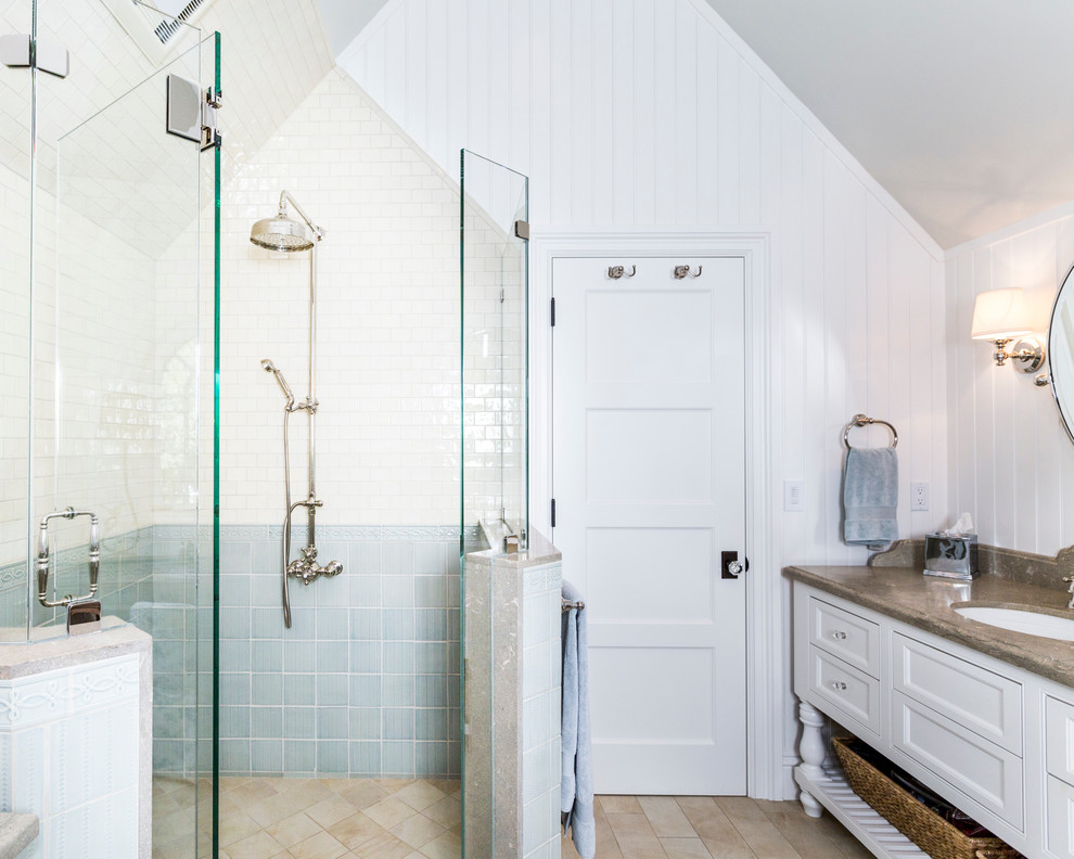 Corner shower - mid-sized master blue tile and mosaic tile porcelain tile corner shower idea in San Francisco with an undermount sink, furniture-like cabinets, white cabinets, limestone countertops and white walls