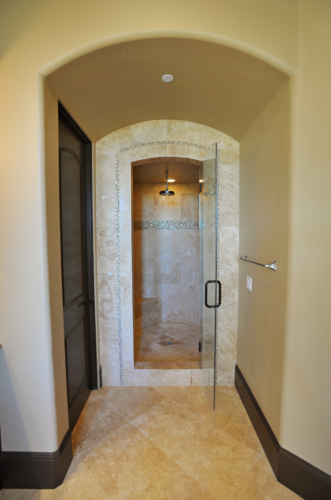 Large tuscan master beige tile and porcelain tile travertine floor and beige floor bathroom photo in Sacramento with raised-panel cabinets, dark wood cabinets, beige walls, an undermount sink, granite countertops, a hinged shower door and a two-piece toilet