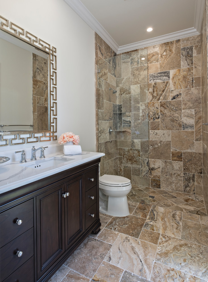 Medium sized classic shower room bathroom in Miami with recessed-panel cabinets, dark wood cabinets, a built-in shower, a two-piece toilet, beige tiles, slate tiles, beige walls, slate flooring, a submerged sink, solid surface worktops and an open shower.
