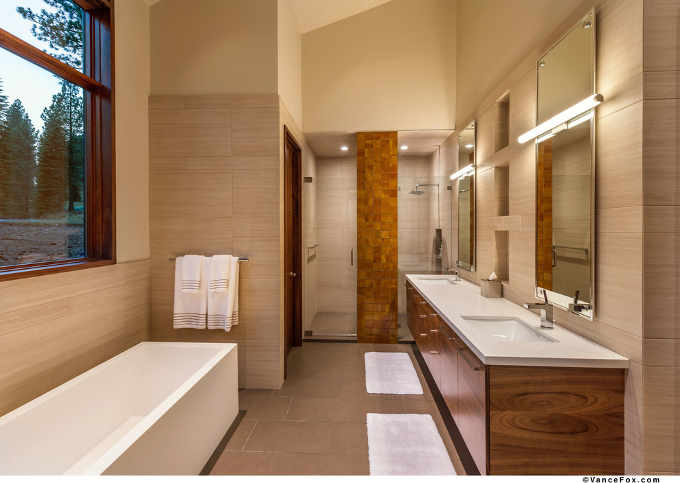 Design ideas for a large contemporary ensuite bathroom in Sacramento with flat-panel cabinets, dark wood cabinets, a freestanding bath, a double shower, a one-piece toilet, white tiles, ceramic tiles, beige walls, ceramic flooring, a built-in sink and soapstone worktops.