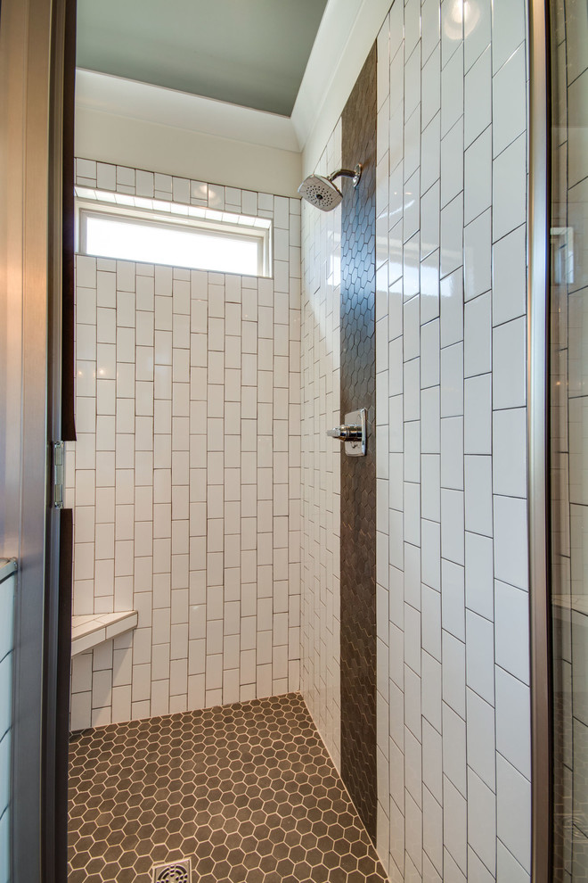 Example of a large arts and crafts master multicolored tile and subway tile porcelain tile and gray floor freestanding bathtub design in Nashville with shaker cabinets, medium tone wood cabinets, white walls, an undermount sink, granite countertops, a hinged shower door and black countertops