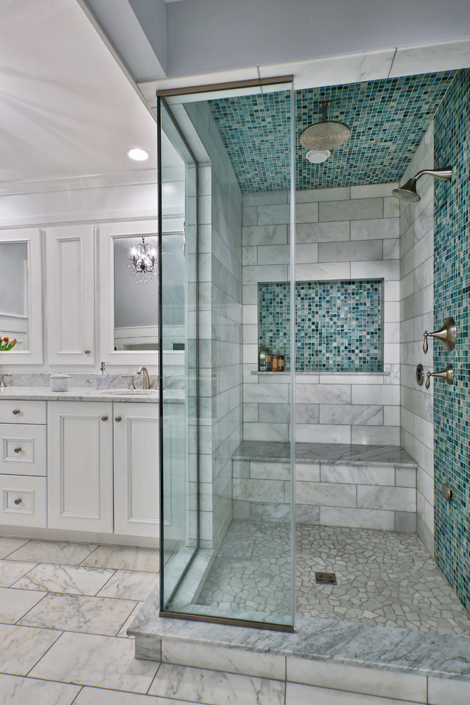 Example of a large transitional master white tile and mosaic tile marble floor bathroom design in Boston with recessed-panel cabinets, white cabinets, blue walls, an undermount sink and marble countertops
