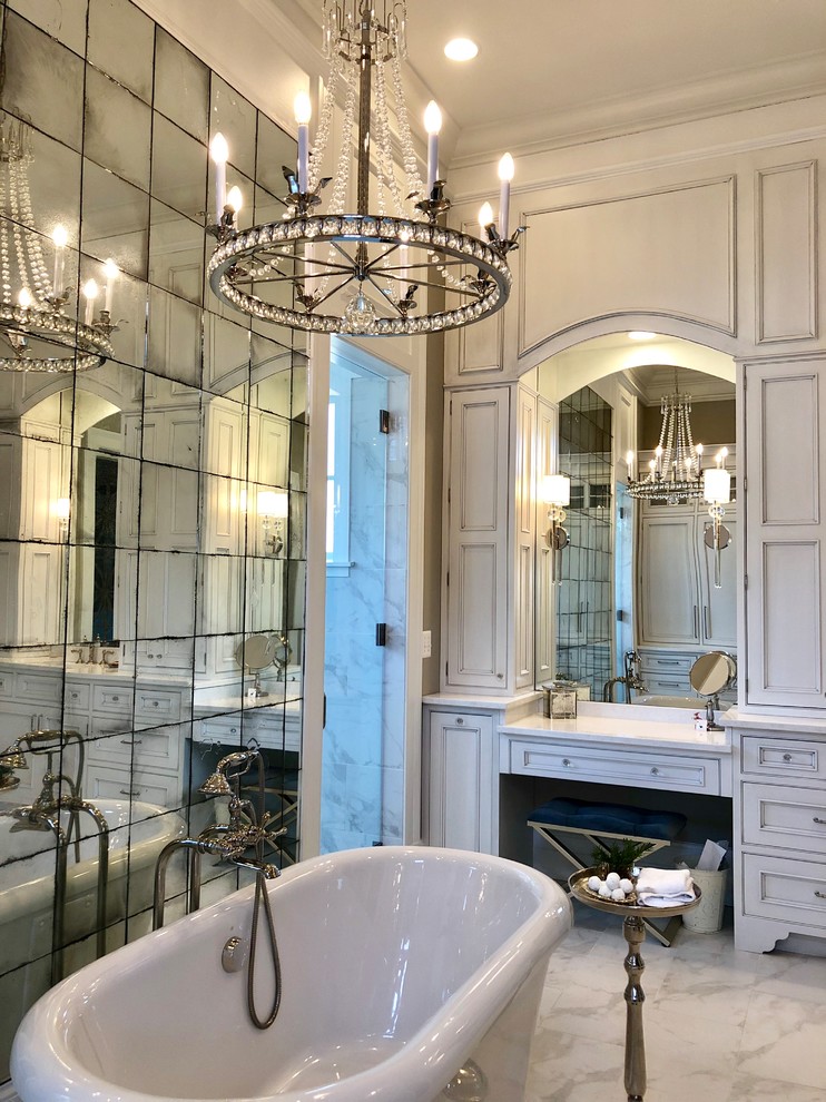 Design ideas for a farmhouse ensuite wet room bathroom in DC Metro with beaded cabinets, white cabinets, a freestanding bath, white tiles, porcelain tiles, beige walls, porcelain flooring, a submerged sink, marble worktops, white floors, a hinged door and white worktops.