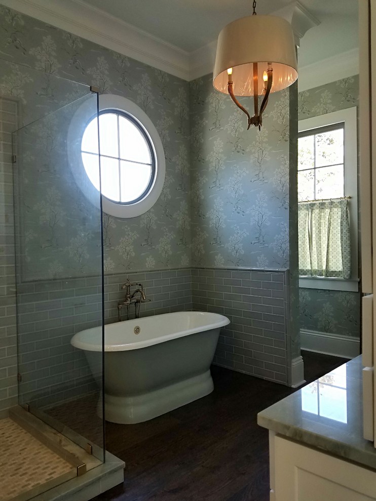 Example of a large transitional master green tile and ceramic tile medium tone wood floor and brown floor bathroom design in New Orleans with furniture-like cabinets, white cabinets, a two-piece toilet, green walls, an undermount sink, quartzite countertops, a hinged shower door and green countertops