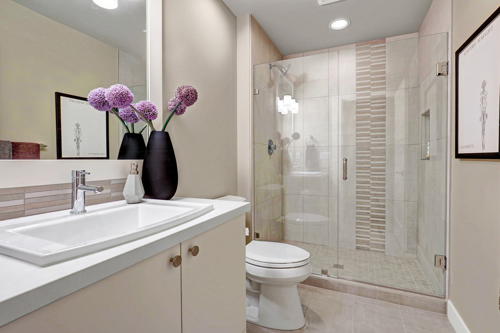 Inspiration for a contemporary 3/4 porcelain tile bathroom remodel in Seattle with flat-panel cabinets, solid surface countertops, a hinged shower door, white cabinets and an undermount sink
