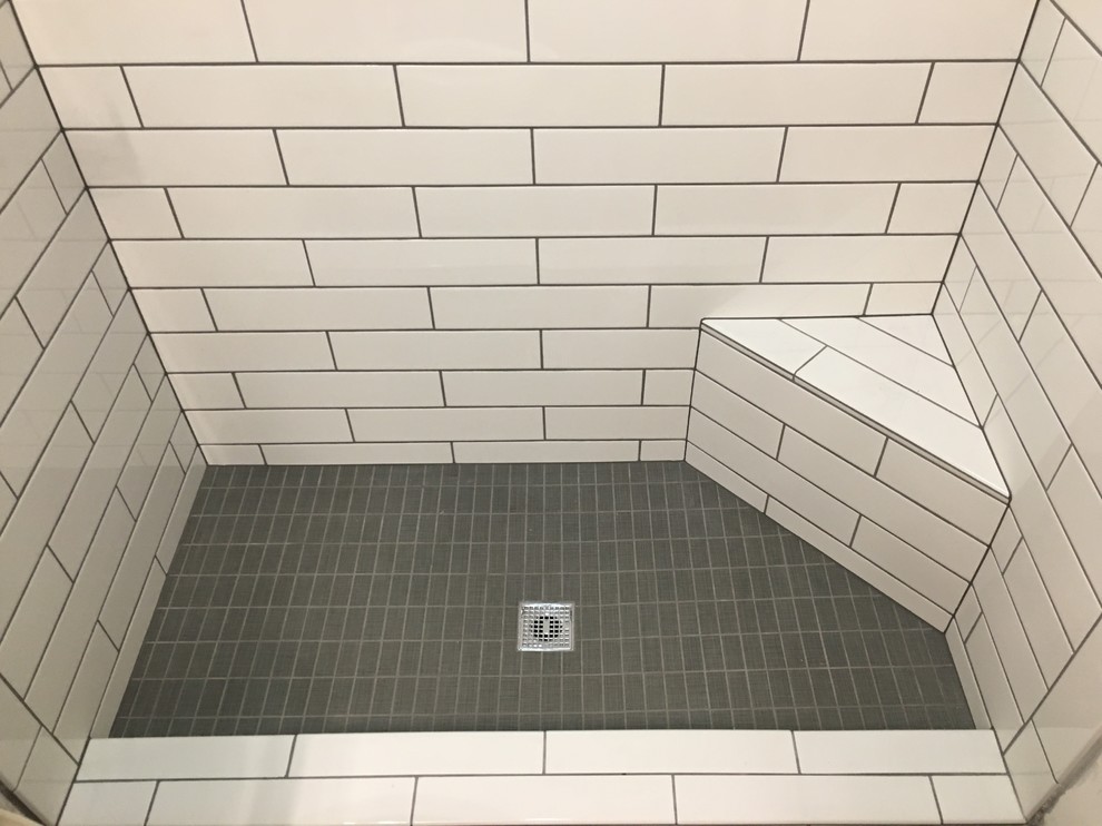 Bathroom - mid-sized modern 3/4 porcelain tile and black floor bathroom idea in Atlanta with flat-panel cabinets, gray cabinets, a two-piece toilet, white walls, a vessel sink, quartz countertops and white countertops