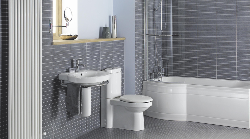 На фото: главная ванная комната среднего размера в современном стиле с подвесной раковиной, накладной ванной, душем над ванной, унитазом-моноблоком, серой плиткой, серыми стенами и полом из линолеума