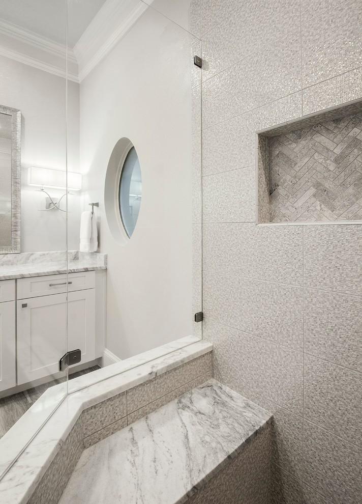 Photo of a medium sized classic ensuite bathroom in Dallas with shaker cabinets, white cabinets, a corner shower, a two-piece toilet, grey tiles, ceramic tiles, brown walls, porcelain flooring, a submerged sink, engineered stone worktops, brown floors, a hinged door and grey worktops.