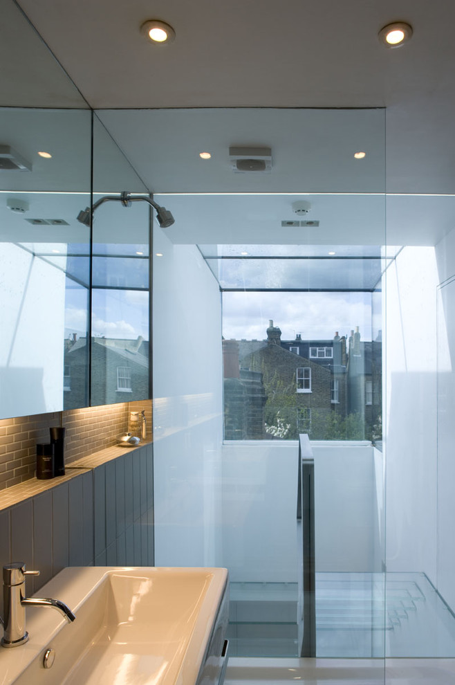 This is an example of a contemporary bathroom in London with a trough sink, a walk-in shower and an open shower.