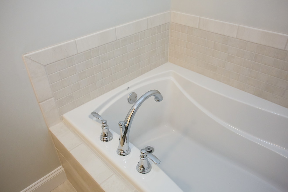 Medium sized classic ensuite bathroom in Atlanta with raised-panel cabinets, grey cabinets, an alcove bath, an alcove shower, a two-piece toilet, grey tiles, ceramic tiles, grey walls, porcelain flooring, a submerged sink, granite worktops, grey floors, a hinged door and multi-coloured worktops.