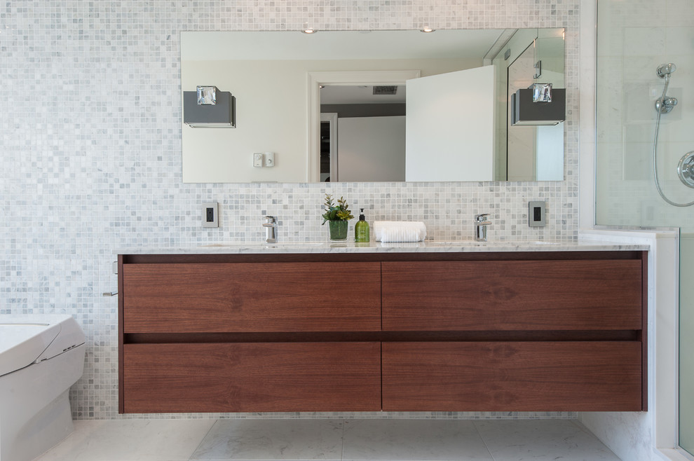 Inspiration for a contemporary bathroom in Vancouver with flat-panel cabinets, dark wood cabinets, white tiles and mosaic tiles.