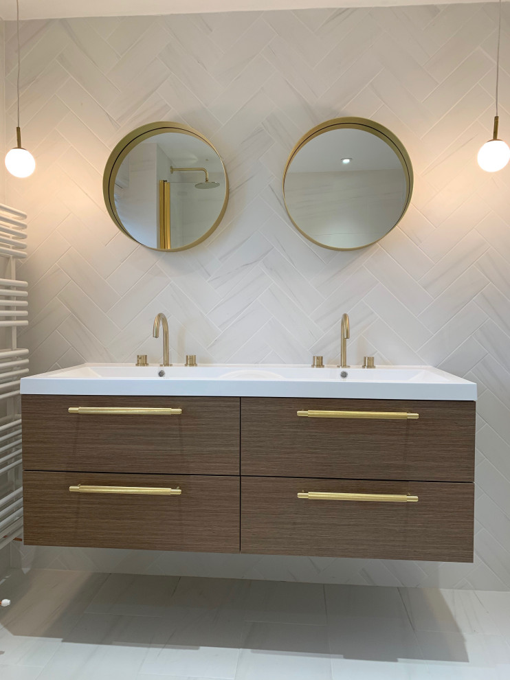 Mid-sized minimalist kids' porcelain tile porcelain tile, white floor and double-sink bathroom photo in Hertfordshire with flat-panel cabinets, medium tone wood cabinets and a floating vanity