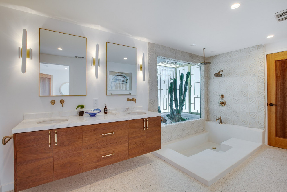 Réalisation d'une salle de bain vintage en bois brun avec un placard à porte plane, une douche d'angle, un carrelage blanc, un mur blanc, un lavabo encastré, un sol blanc, aucune cabine, un plan de toilette blanc, meuble double vasque et meuble-lavabo suspendu.