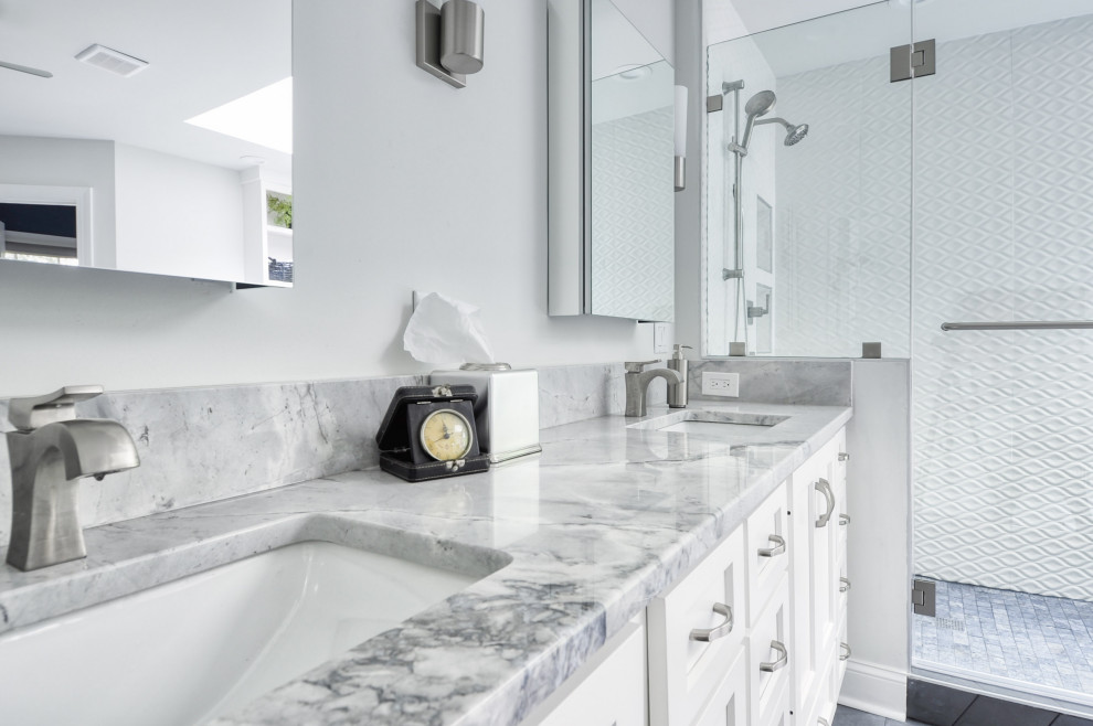 Bathroom - mid-sized modern master white tile and ceramic tile cement tile floor and gray floor bathroom idea in DC Metro with recessed-panel cabinets, white cabinets, a two-piece toilet, gray walls, an undermount sink, marble countertops, a hinged shower door and white countertops