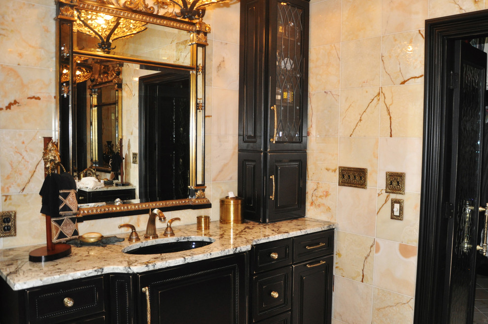 Inspiration for an expansive traditional ensuite bathroom in Other with a submerged sink, beaded cabinets, black cabinets, a double shower, beige tiles and beige walls.